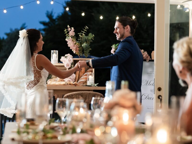 Bride,And,Groom,Dancing,Joyfully,At,Outdoor,Wedding,Reception,Under